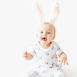 Baby in Cottontail or Bunny print half sleeve bodysuit wearing bunny ears